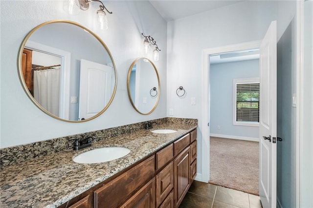 5398 Prairie Dawn Trl, College Station, TX 77845 - full bathroom with double vanity, a sink, baseboards, and tile patterned floors