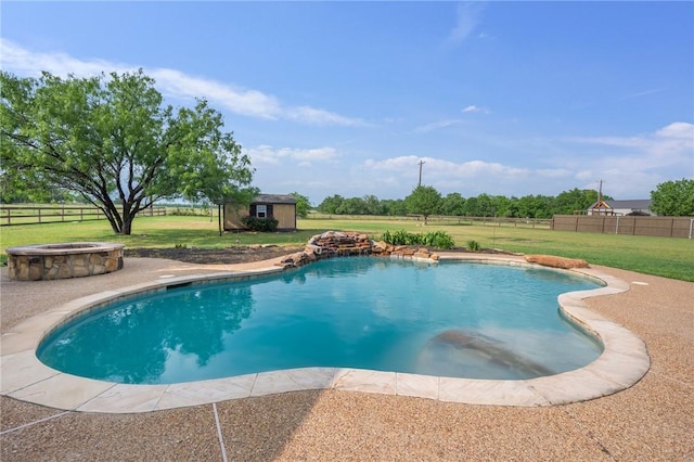 5398 Prairie Dawn Trl, College Station, TX 77845 - outdoor pool with a lawn, an outdoor structure, an outdoor fire pit, and a shed