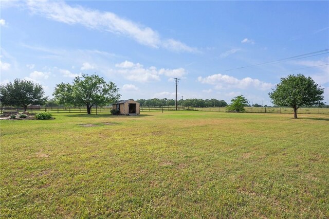 5398 Prairie Dawn Trl, College Station, TX 77845 - view of yard featuring a rural view, fence, and an outbuilding
