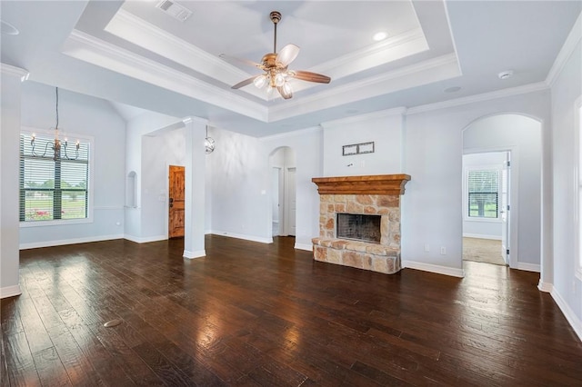 5398 Prairie Dawn Trl, College Station, TX 77845 - unfurnished living room featuring arched walkways, a tray ceiling, and visible vents