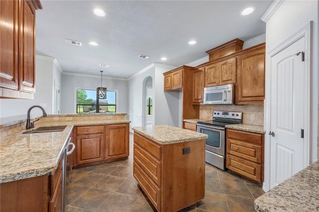5398 Prairie Dawn Trl, College Station, TX 77845 - kitchen featuring visible vents, a sink, appliances with stainless steel finishes, and crown molding