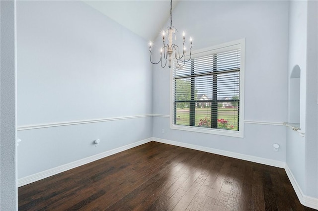 5398 Prairie Dawn Trl, College Station, TX 77845 - unfurnished dining area with dark wood-style flooring, baseboards, an inviting chandelier, and lofted ceiling