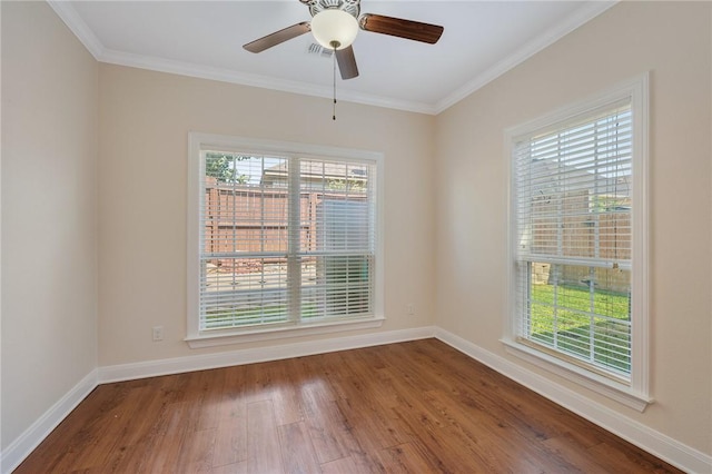 spare room featuring hardwood / wood-style floors, ceiling fan, and ornamental molding