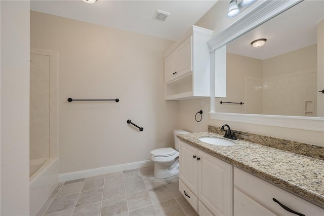 bathroom with tile patterned flooring, vanity, and toilet