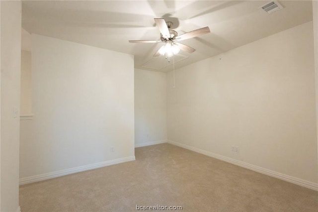 unfurnished room featuring light colored carpet and ceiling fan