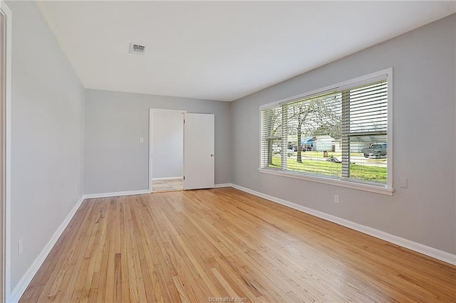 spare room with light wood-type flooring