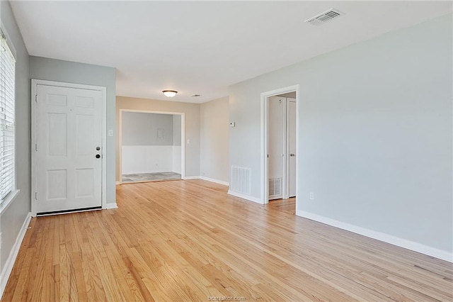 spare room with light hardwood / wood-style flooring