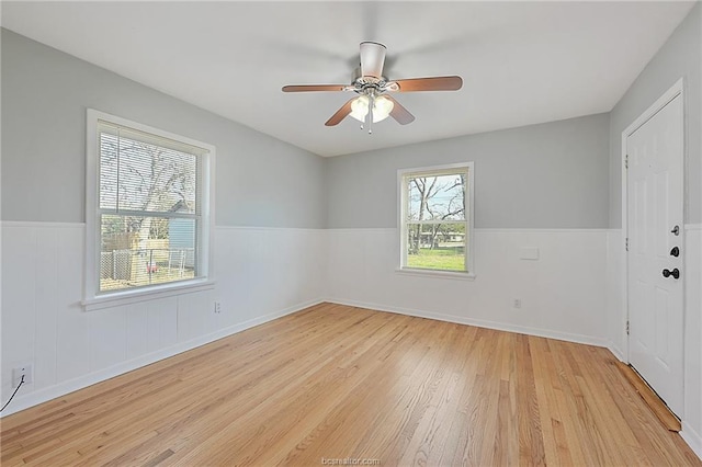 spare room featuring ceiling fan and light wood-type flooring