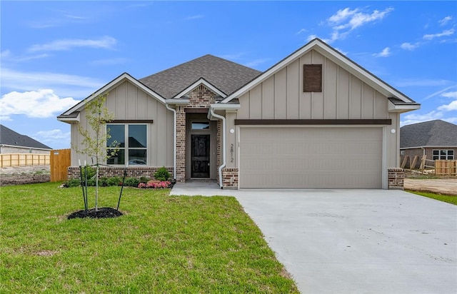 view of front of house with a garage and a front lawn