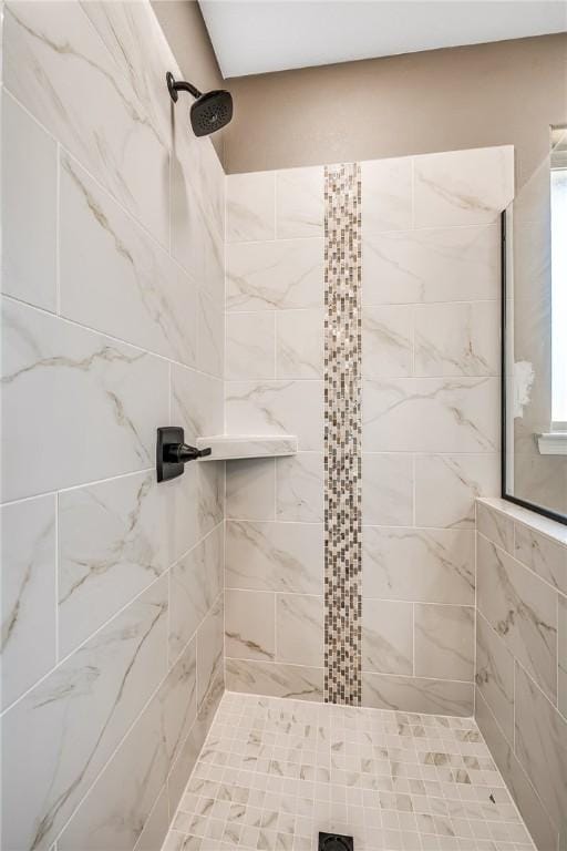 bathroom featuring tiled shower