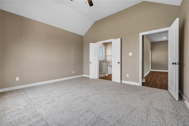 unfurnished bedroom with vaulted ceiling, ceiling fan, and carpet