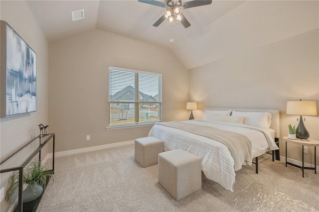 carpeted bedroom with vaulted ceiling and ceiling fan