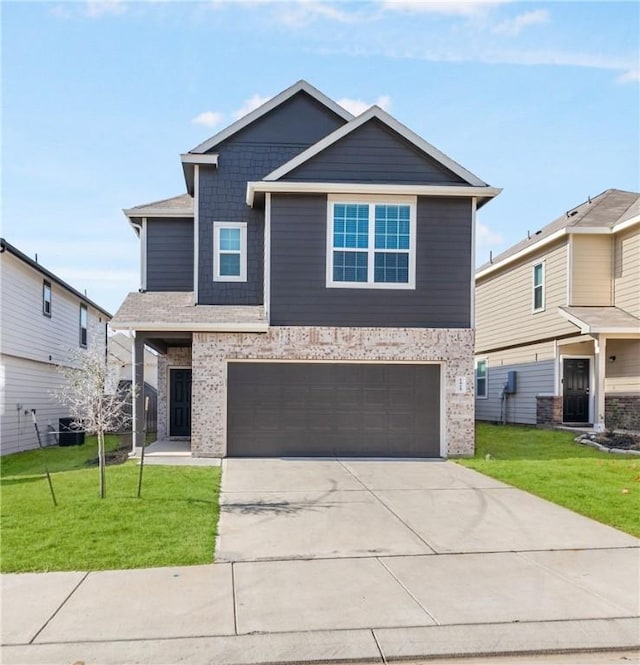 view of front of house with a front lawn and a garage