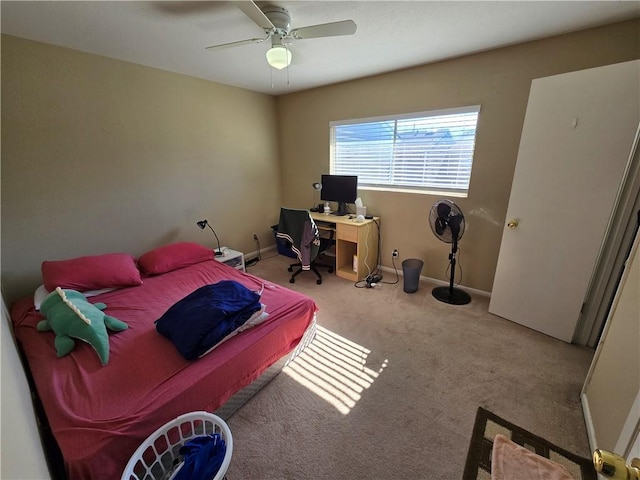 bedroom featuring light colored carpet and ceiling fan