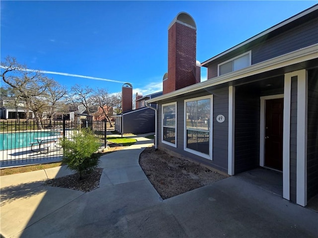 view of patio featuring a fenced in pool