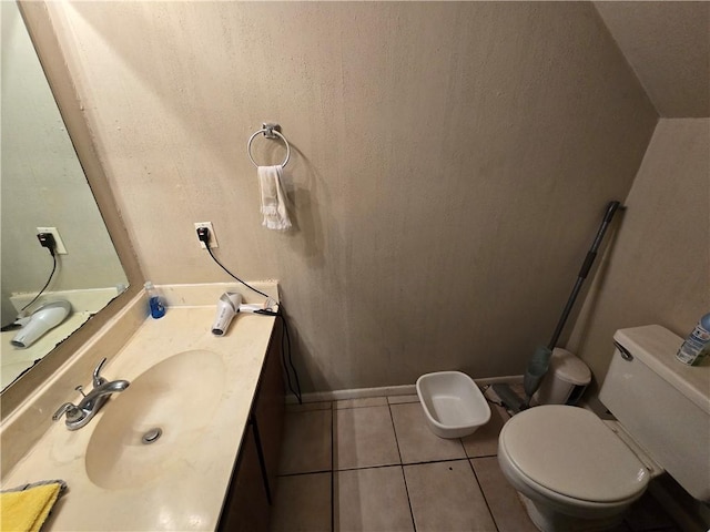 bathroom with tile patterned floors, vanity, and toilet