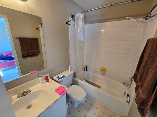 full bathroom with vanity, shower / tub combo, and toilet