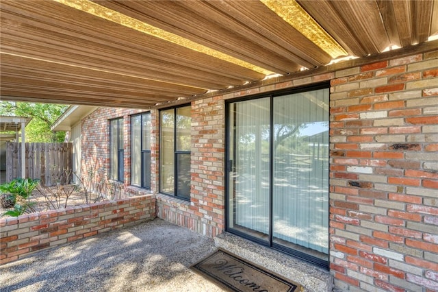 property entrance featuring a patio area