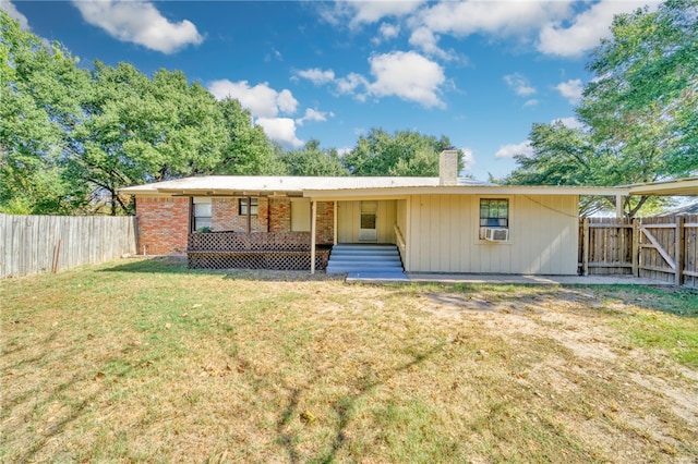 ranch-style house with a front lawn