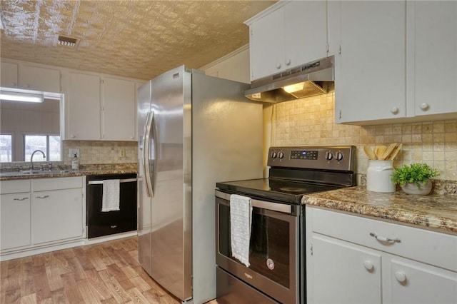 kitchen featuring stainless steel electric range oven, sink, black dishwasher, light hardwood / wood-style flooring, and white cabinets