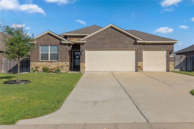 view of front of house featuring a garage and a front yard