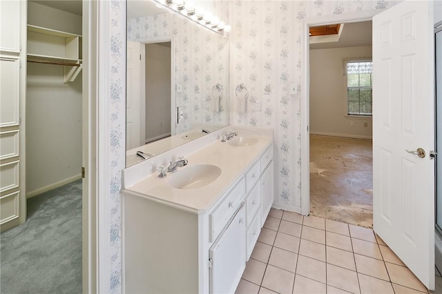 bathroom with tile patterned flooring and vanity