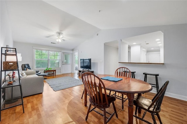 1725 Harvey Mitchell Pkwy S Unit 2433, College Station, TX 77840 - dining area featuring vaulted ceiling, ceiling fan, light wood finished floors, and baseboards