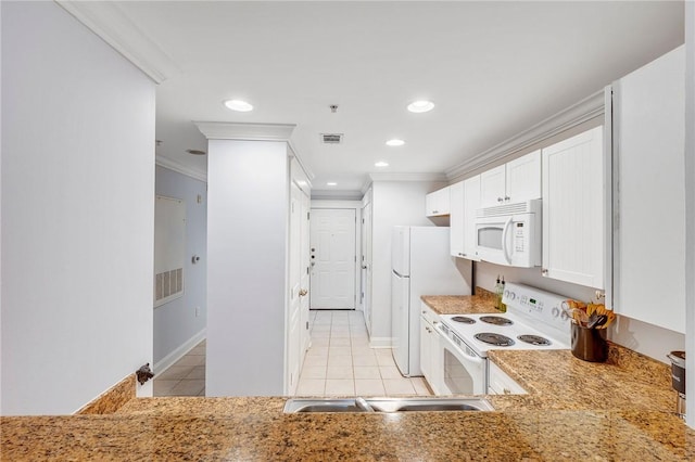 1725 Harvey Mitchell Pkwy S Unit 2433, College Station, TX 77840 - kitchen with white appliances, light tile patterned floors, ornamental molding, white cabinetry, and baseboards