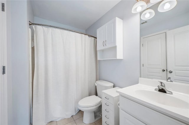 1725 Harvey Mitchell Pkwy S Unit 2433, College Station, TX 77840 - full bath featuring vanity, toilet, tile patterned floors, and a shower with shower curtain