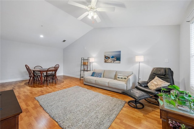 1725 Harvey Mitchell Pkwy S Unit 2433, College Station, TX 77840 - living room featuring vaulted ceiling, a ceiling fan, light wood-style flooring, and baseboards