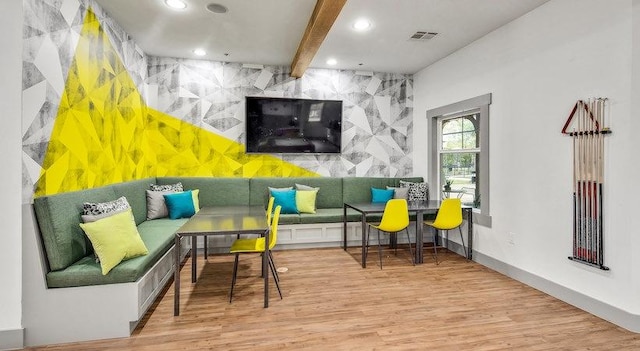 1725 Harvey Mitchell Pkwy S Unit 2433, College Station, TX 77840 - living room with wood finished floors, an accent wall, recessed lighting, breakfast area, and beamed ceiling
