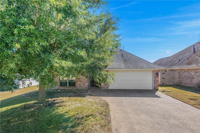 view of front facade featuring a garage and a front lawn