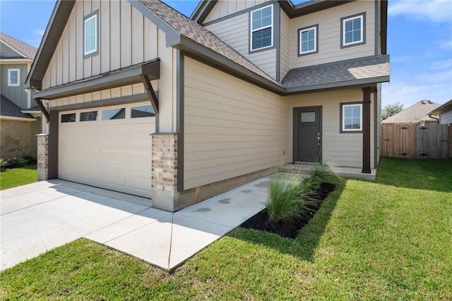 view of front facade with a garage and a front lawn