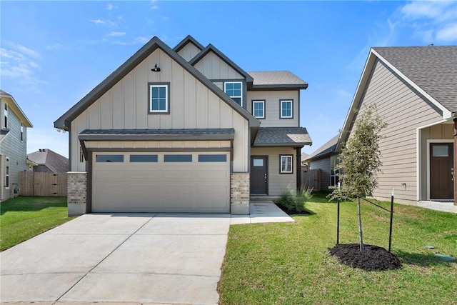 craftsman inspired home with a front yard and a garage