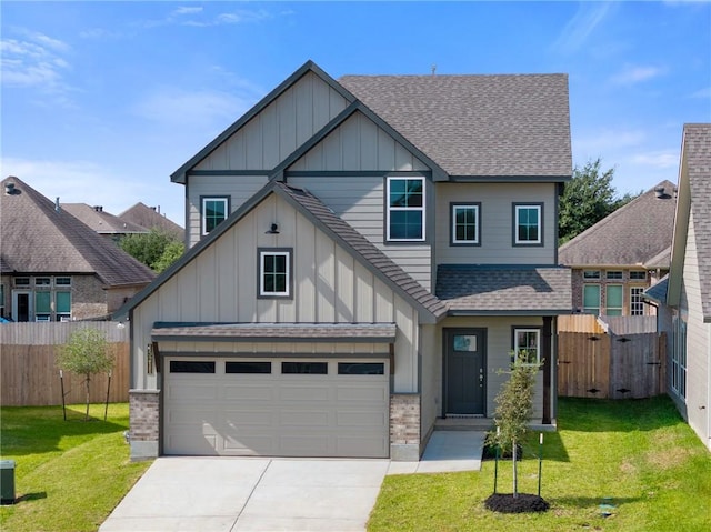 craftsman-style home with a garage and a front lawn