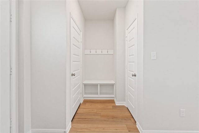 hall with light hardwood / wood-style flooring