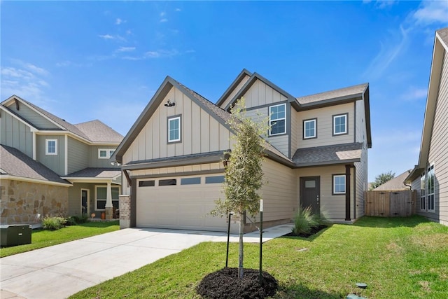 view of front of house with a garage and a front lawn