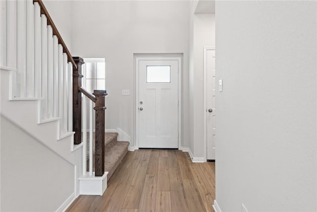 entryway with light hardwood / wood-style floors