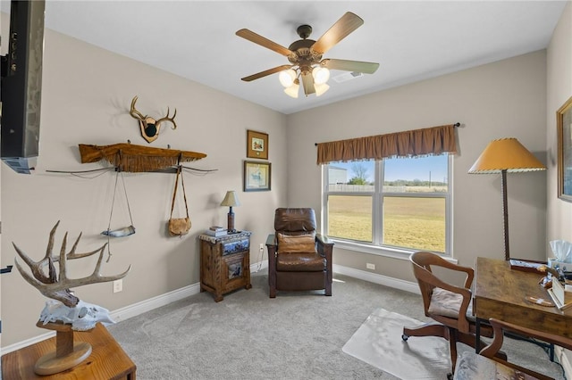 office area featuring light colored carpet and ceiling fan