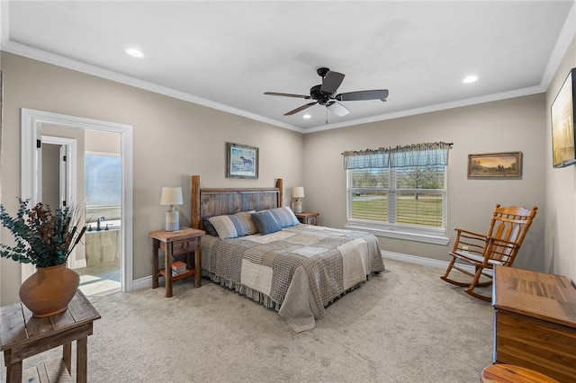 carpeted bedroom featuring connected bathroom, ceiling fan, and crown molding