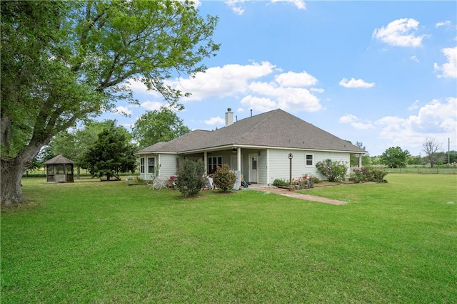 32287 Rochen Rd, Waller, TX 77484 - rear view of property with a gazebo, a chimney, and a lawn