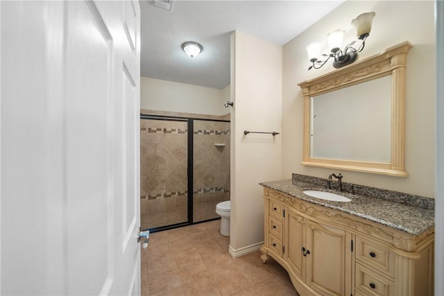 32287 Rochen Rd, Waller, TX 77484 - bathroom featuring toilet, tiled shower, vanity, and tile patterned floors