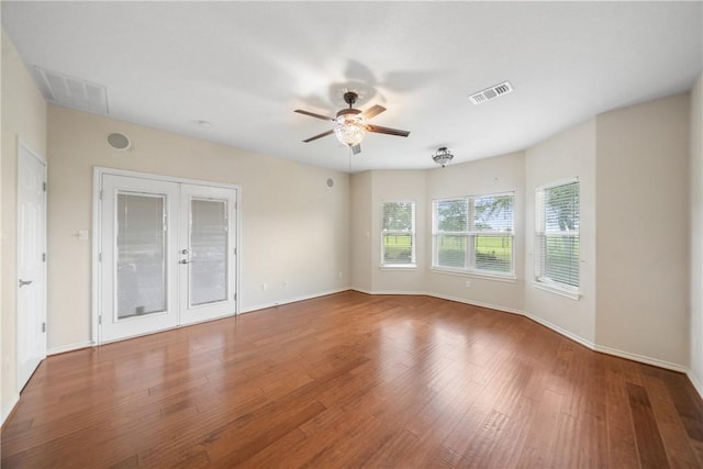 32287 Rochen Rd, Waller, TX 77484 - unfurnished room featuring french doors, ceiling fan, wood finished floors, and baseboards