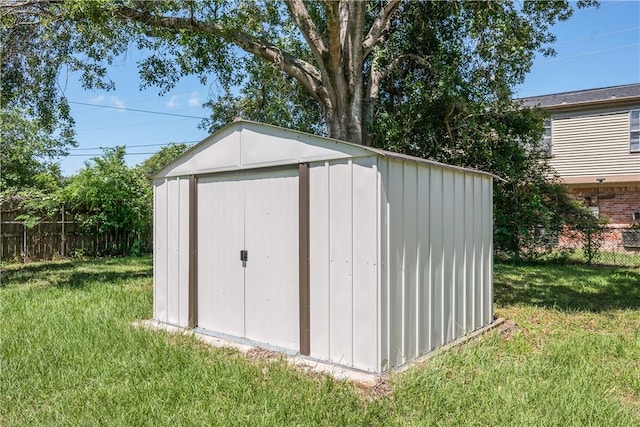 view of shed with fence