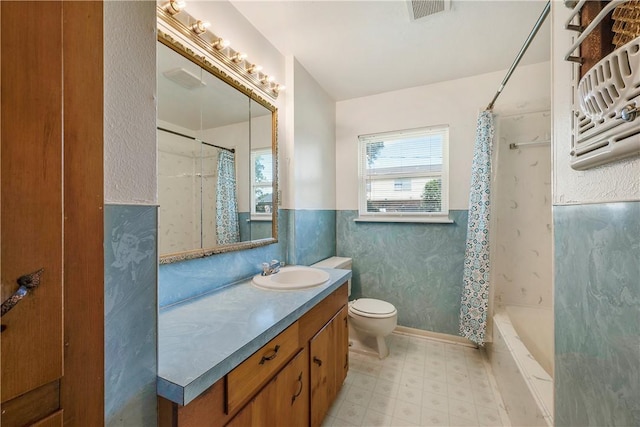 full bathroom with visible vents, vanity, curtained shower, toilet, and tile patterned floors