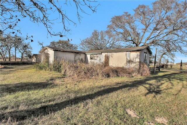 24248 State Highway 6 S, Navasota, TX 77868 - view of side of home featuring a lawn