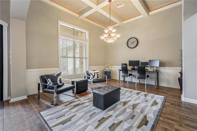 home office with dark wood-type flooring, coffered ceiling, beam ceiling, and a notable chandelier