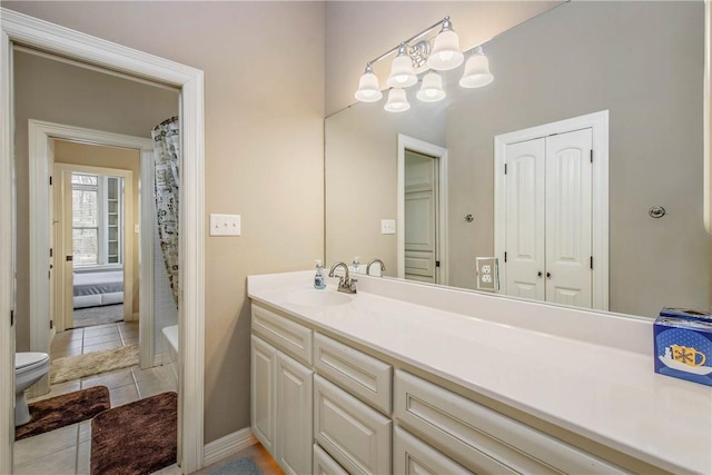 full bathroom with vanity, shower / bath combo, tile patterned floors, and toilet