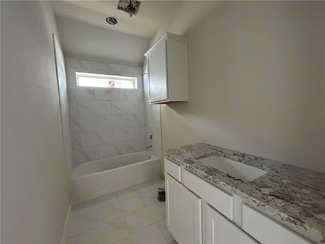 2814 Messenger Way, Bryan, TX 77802 - full bathroom with vanity, marble look tiles, and shower / bathtub combination
