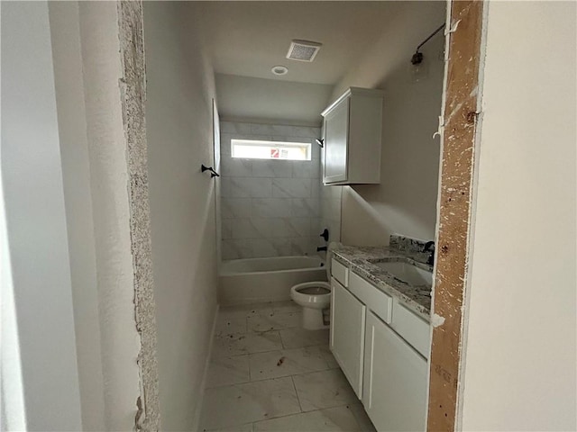 2814 Messenger Way, Bryan, TX 77802 - bathroom featuring marble look tiles, vanity, and washtub / shower combination